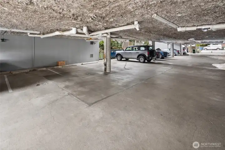 Secure, covered parking space #4 plus a dedicated storage unit located in the bank directly in front of the parking spot - easy in, easy out.