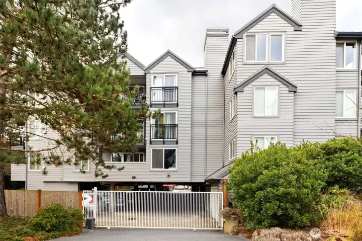 Gated, covered garage with entry from either N 59th or N 60th Street — flexibility that just makes life simpler.
