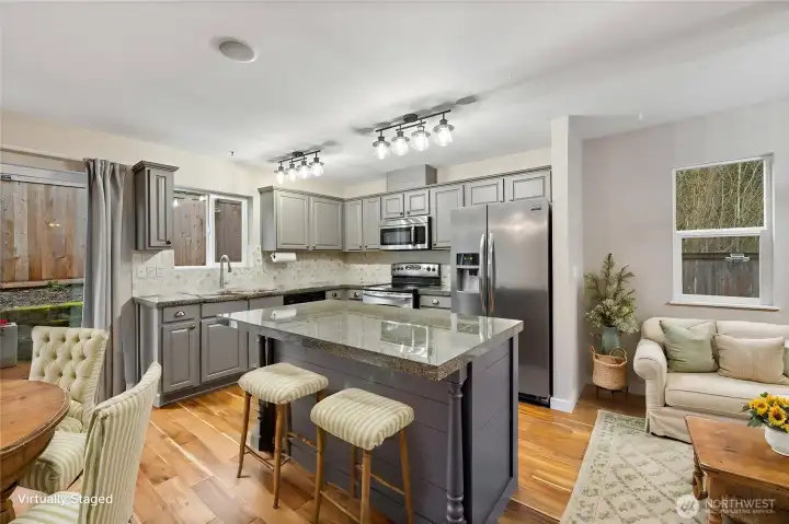 This move in ready home has an open floor plan with a kitchen that is truly the heart of the home. (Virtually staged)