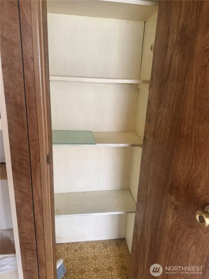 Pantry closet in the entry between your washer/dryer and your kitchen for storage
