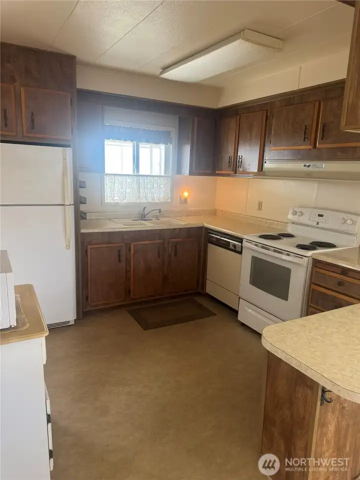 Kitchen opens to dining area