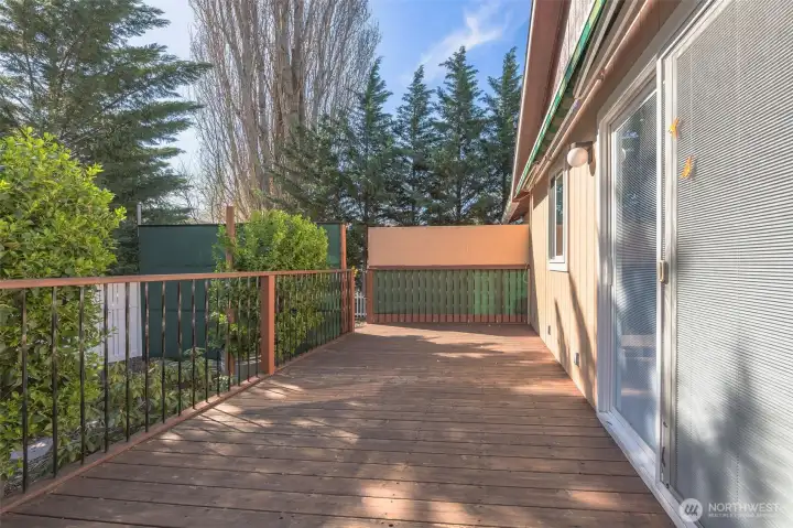 Deck with retractable shade facing hot tub area