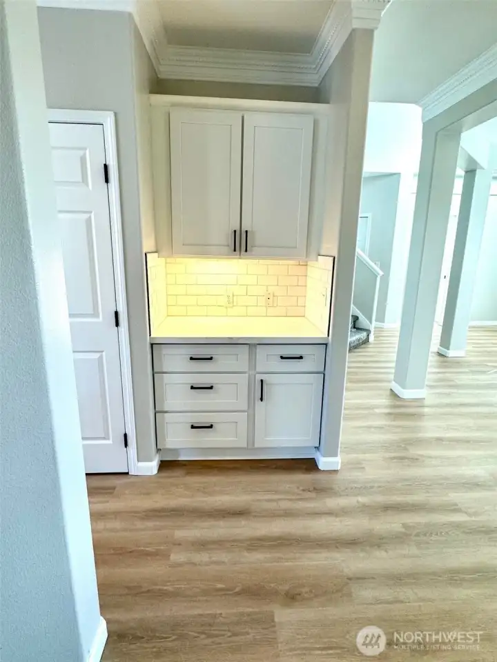 Butller's pantry with undercabinet lighting. Perfect place for coffee station!