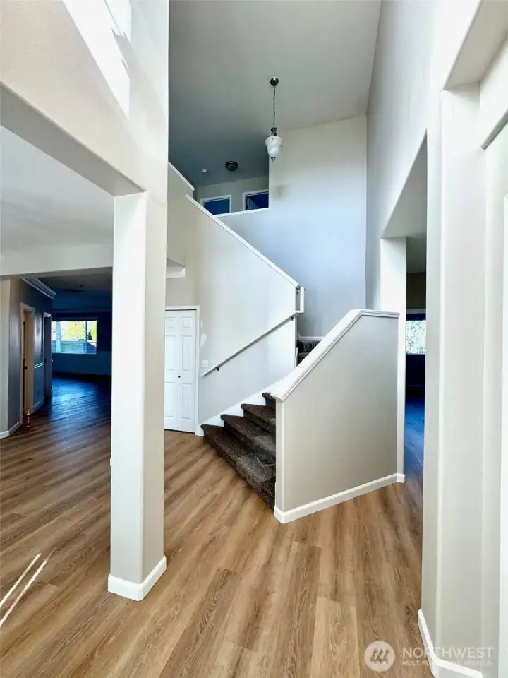 Entry is vaulted and offers a formal dining area to the left.