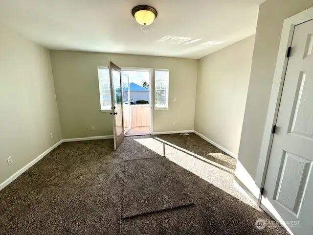 This upstairs bedroom has its own private deck looking out at Mt. Rainier!