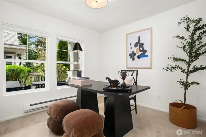 A bright room with views of the greenery just outside.