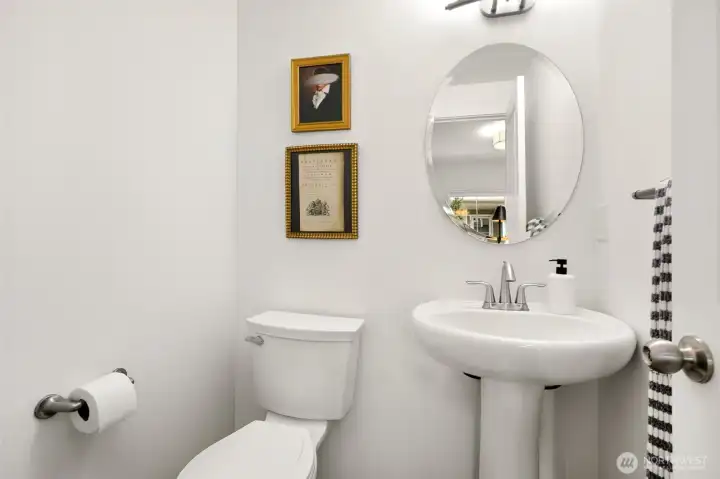 Powder room off office space. This is the first of three bathrooms total.