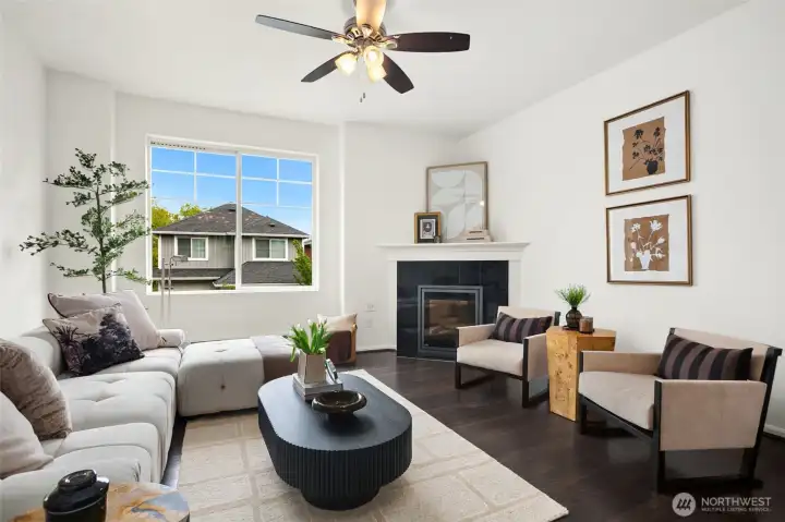 The fireplace creates a natural focal point, with room to layer in extra seating for hosting or stretching out comfortably.