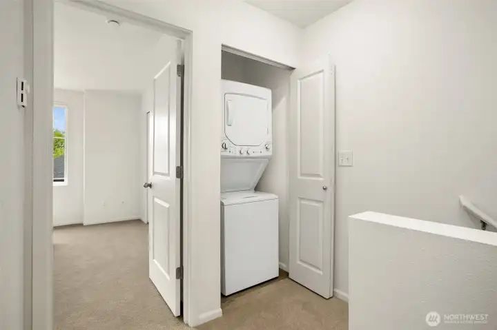 Washer/dryer conveniently located near the bedrooms on the top level.