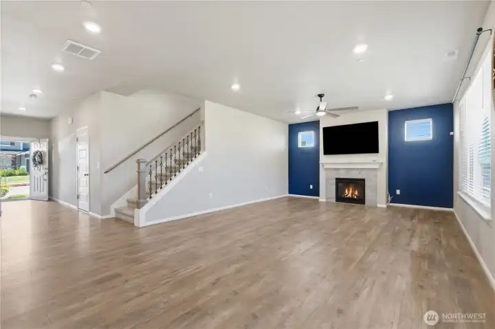 Beautiful engineered hardwood floors throughout to unify the living areas. A gas fireplace with mantel and tile surround is the focal point. Beautiful engineered hardwood floors throughout to unify the living areas. A gas fireplace with mantel and tile surround is the focal point.