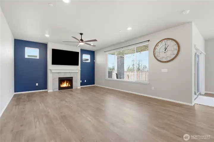 Large windows bring in natural light for this spacious living room. Large windows bring in natural light for this spacious living room.