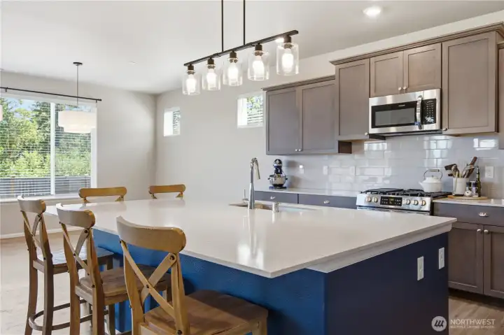 The new designer trends are for darker cabinets and color accented islands. A large island is perfect for entertaining. The new designer trends are for darker cabinets and color accented islands. A large island is perfect for entertaining.
