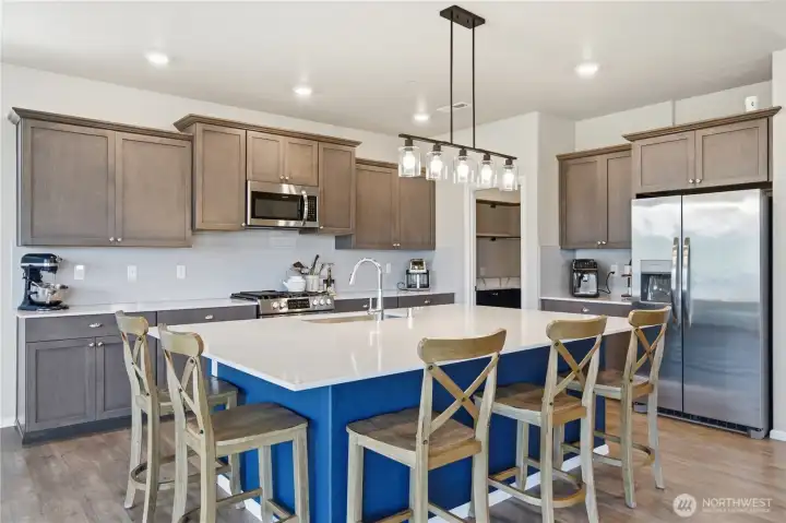 Stainless steel appliances, quartz counters, lots of prep space and storage. Stainless steel appliances, quartz counters, lots of prep space and storage.
