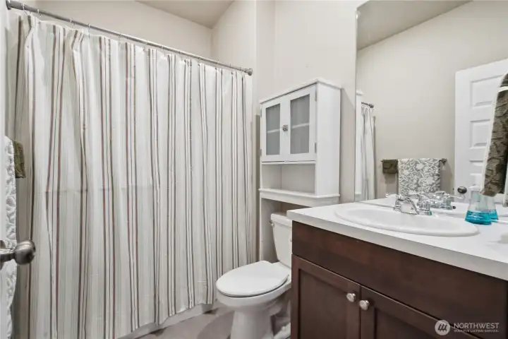 This 3/4 bath is adjacent to the guest bedroom on the main floor. This 3/4 bath is adjacent to the guest bedroom on the main floor.
