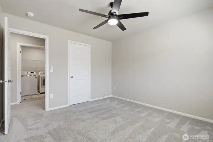 Laundry room is conveniently located near bedrooms. This bedroom features a walk-in closet. Laundry room is conveniently located near bedrooms. This bedroom features a walk-in closet.