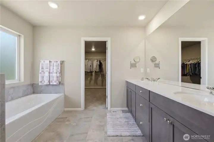 This spa-like bathroom is a dream with spacious cabinets for storage, a double sink, full length mirror, large soak tub. Walk-in shower next photo. This spa-like bathroom is a dream with spacious cabinets for storage, a double sink, full length mirror, large soak tub. Walk-in shower next photo.