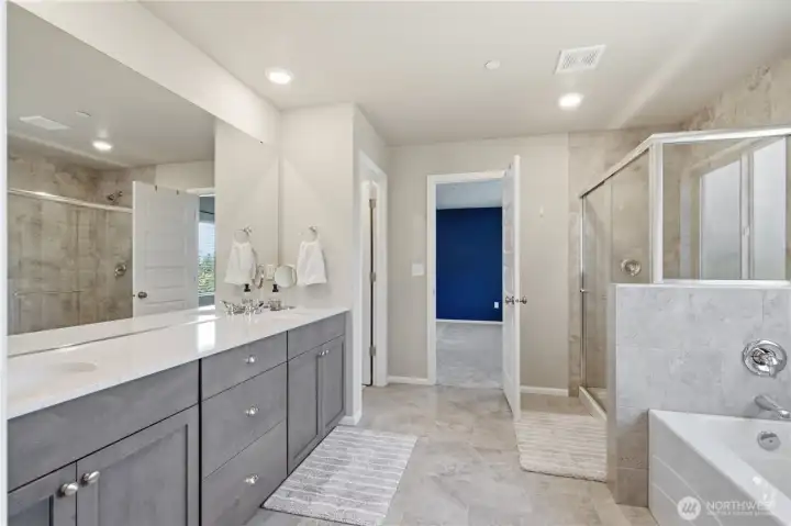 This view of the bathroom includes the large walk-in shower and door to the left for the separate toilet room. This view of the bathroom includes the large walk-in shower and door to the left for the separate toilet room.