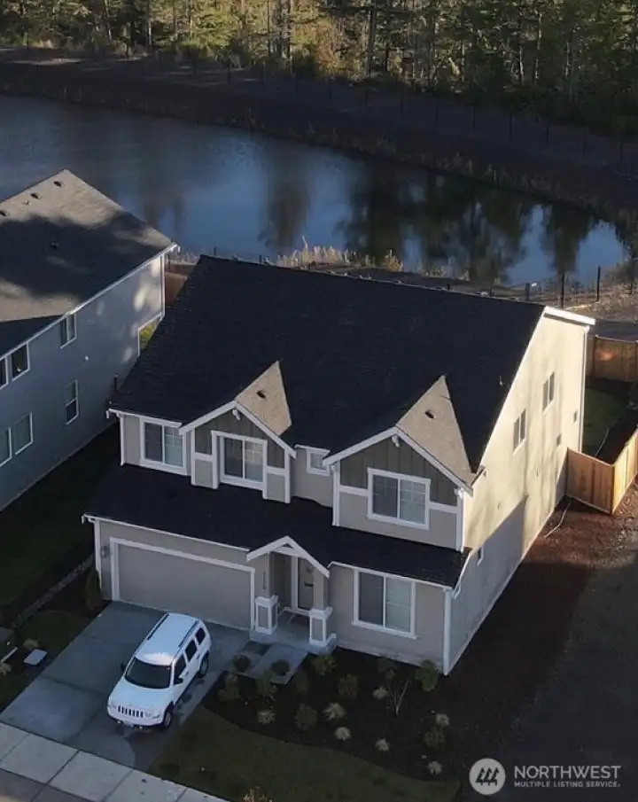 HOA owned property behind this row of homes protects the private feeling in this beautiful home. HOA owned property behind this row of homes protects the private feeling in this beautiful home.