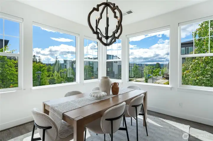 Gorgeous windows surround the dining area for a bright, serene view.