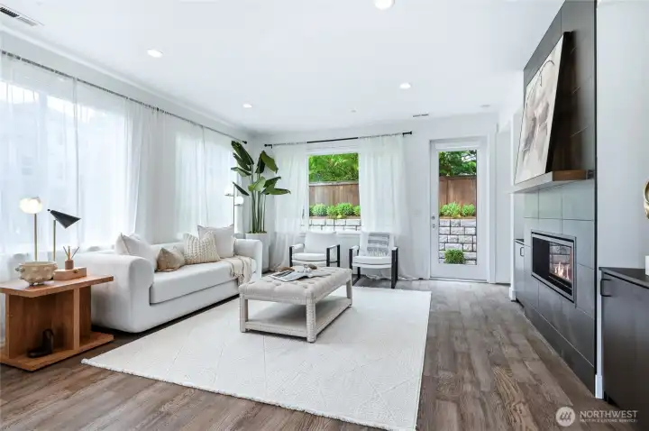 Spacious living room with cozy gas fireplace.