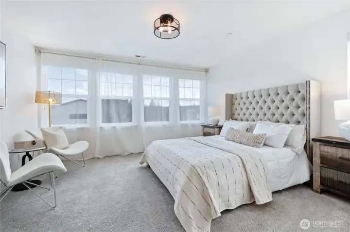 Primary suite with more bright windows for loads of natural light.