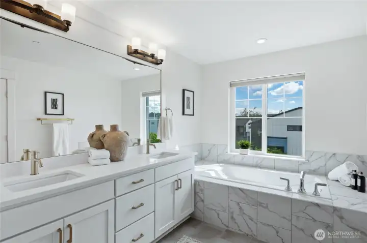 Designer's touches in this 5-piece primary bathroom, plus a walk in closet!