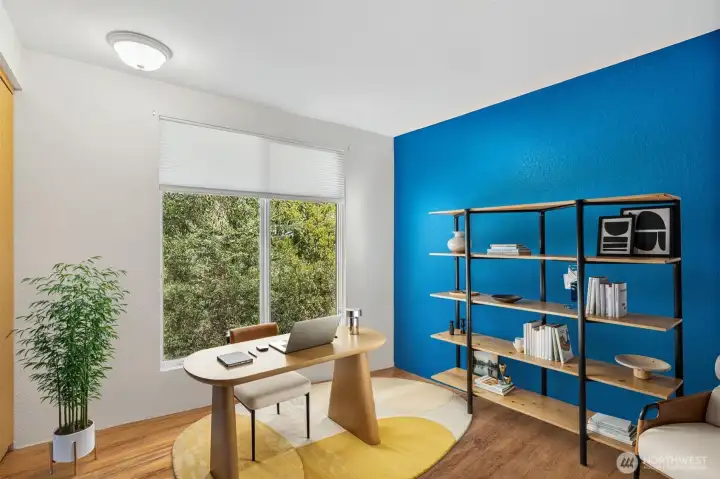 Bedroom 1 - virtually staged - used as an office with hardwood floors