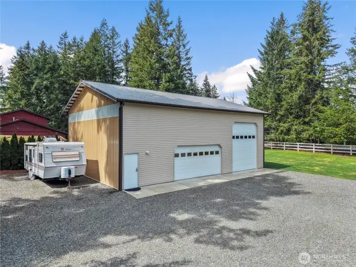 Bring all your hobbies and toys! Holds 4 cars and 1 Rv! Massive mezzanine w/wide walk up stairs for all your storage needs.