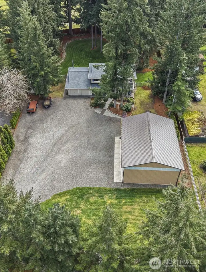 Look at all the parking and mature grounds! 6 covered parking, 1 rv covered and room for multiple recreational toys and cars!