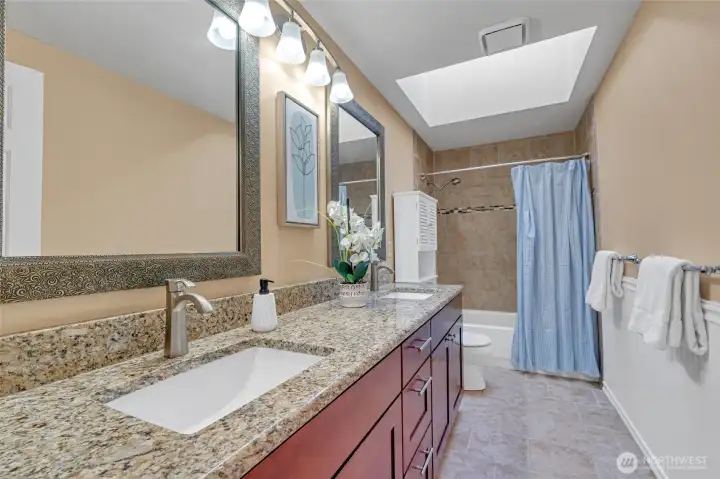 Full hall bath with double  vanity & skylight.
