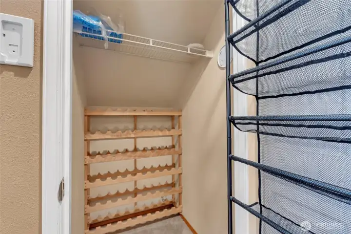 Hall coat closet near half bath.