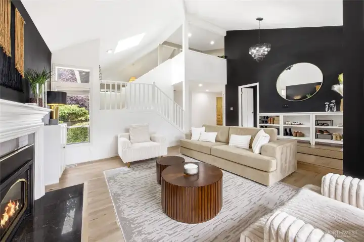 A secondary perspective of the living room emphasizing the grand scale, architectural lines, and the seamless transition between spaces—entirely carpet-free for a sleek, clean, and hypoallergenic finish.