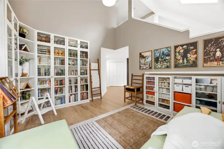 Detail view of the library wall, showcasing immaculate finish work, generous storage, and a layout optimized for a sophisticated home executive office or study or used as formal dining room.