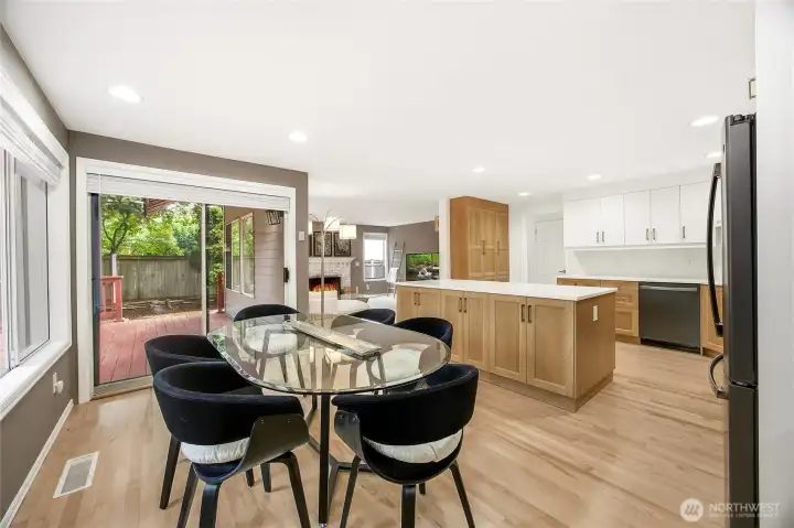Close-up view of the kitchen's high-end finishes, featuring contemporary minimalist pulls, a modern tile backsplash, and a bright, functional workspace layout.