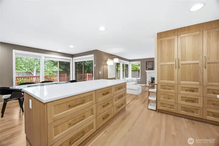 The casual dining nook off the kitchen features direct access to the outdoor living space through sliding glass doors, maximizing the indoor-outdoor Pacific Northwest lifestyle.