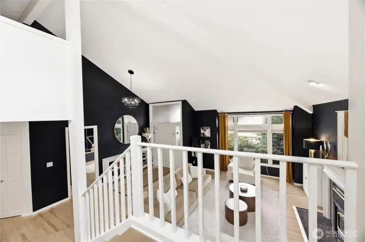 A view of the wide upper-level landing, showcasing the continuous high-end hard-surface flooring leading to the private bedrooms.
