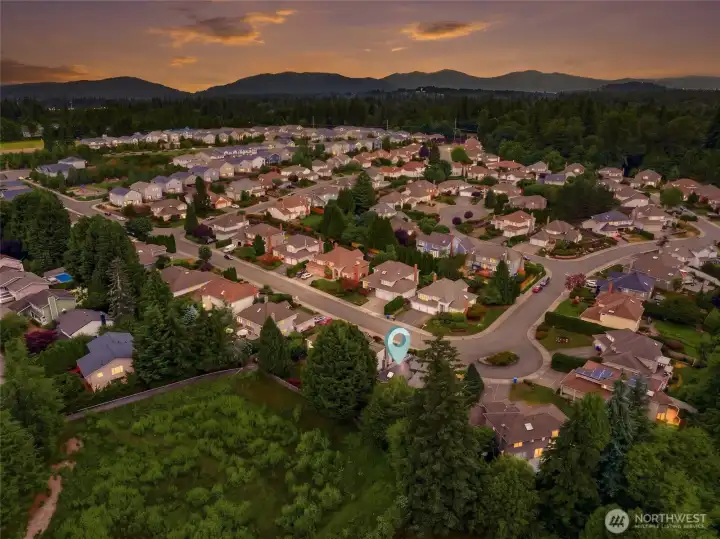Spectacular neighborhood aerial capturing the serene Pacific Northwest backdrop, located just minutes from the prestigious Fairwood Golf & Country Club.