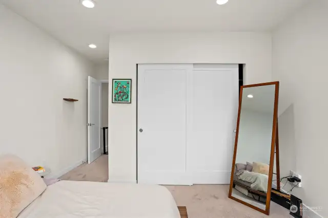 Another look at the primary suite shows the spacious closets this room affords.