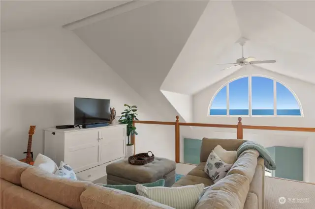 3rd floor loft bedroom with closet and Murphy bed below TV