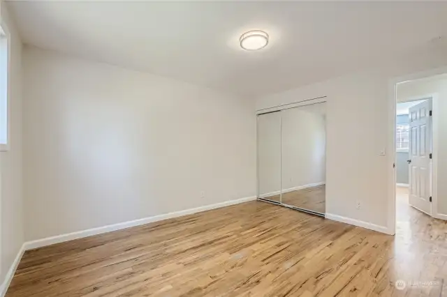 Primary Bedroom with mirrored closet doors