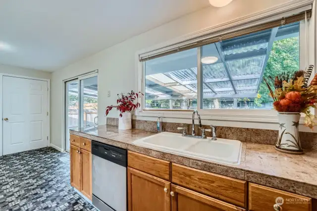 Kitchen view w/eating area-Tile granite counter tops