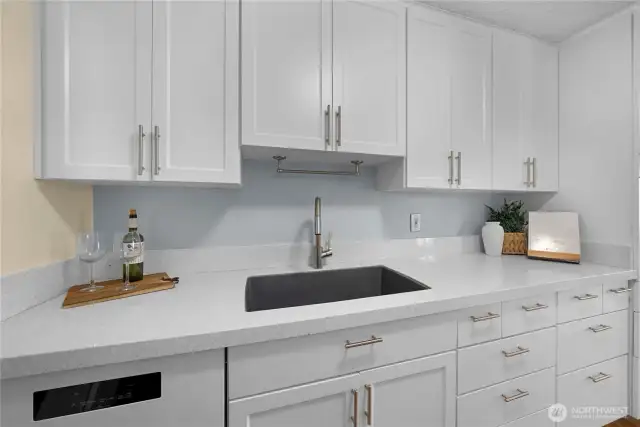 Ample cabinet space spans the entire kitchen.