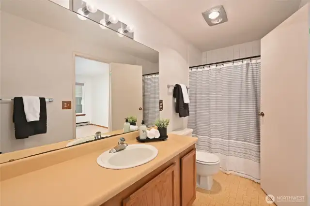 Full bath has access from hall and primary bedroom.