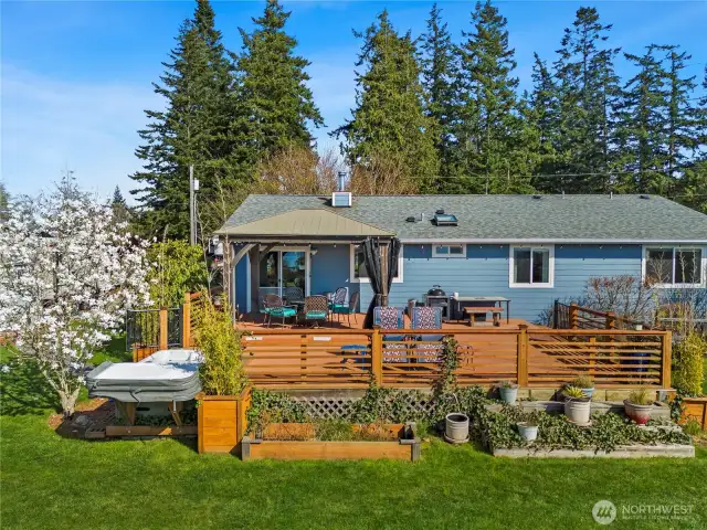 This deck is elaborate with the Hot tub just off the corner