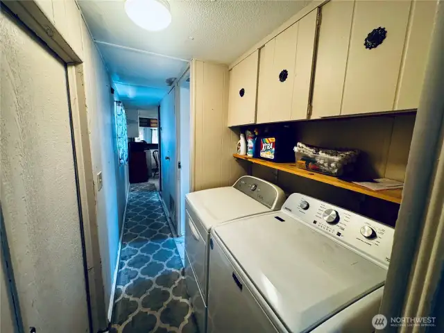 Utility area with washer and dryer