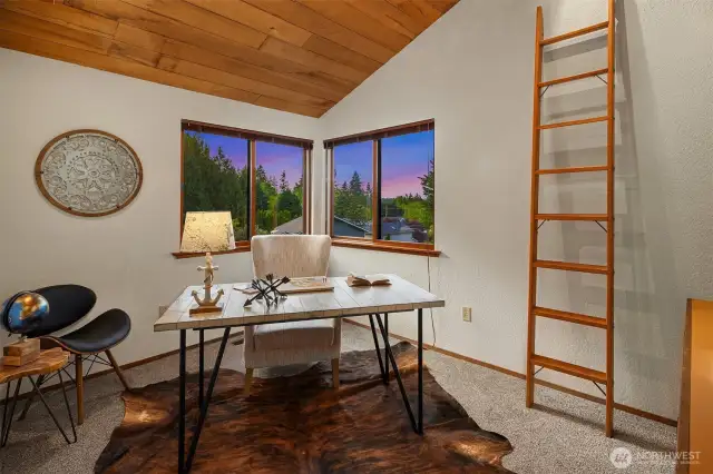 The second of three bedrooms upstairs can also be used as a home office.