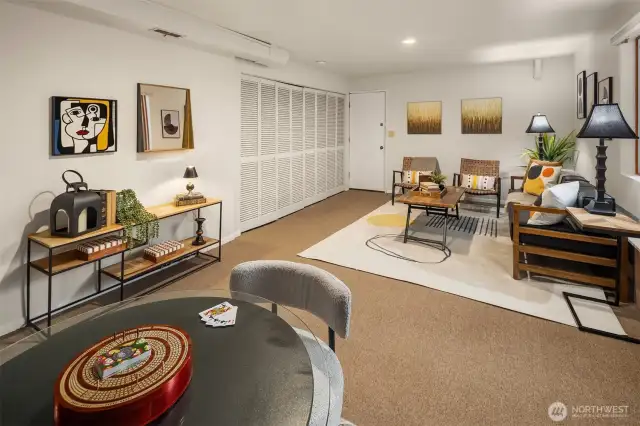 This downstairs living space connects to the studio/art room/hobby space through the door seen in the photo.