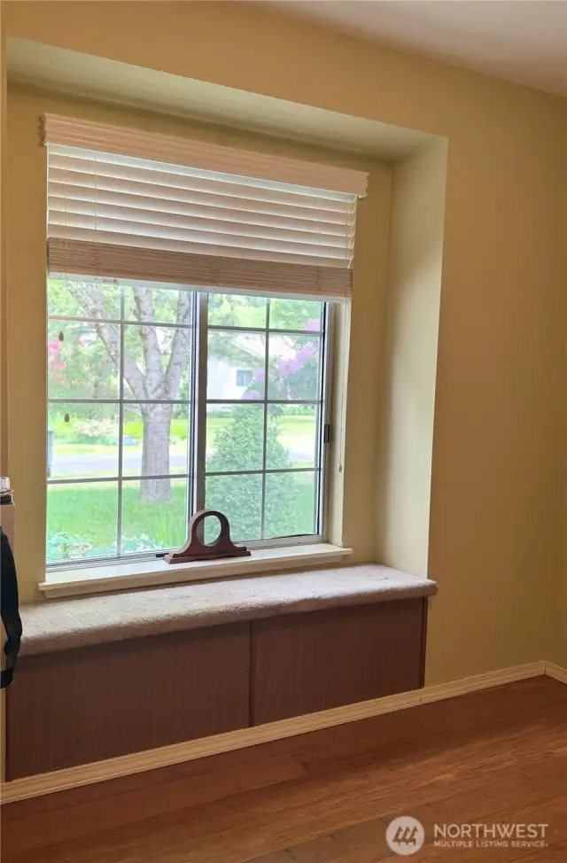 First bedroom with window seat that opens up for storage