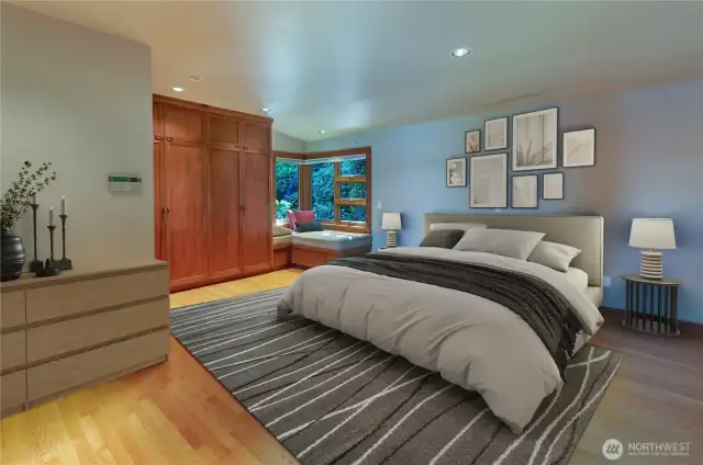 Virtually staged Primary Bedroom has corner lounging space and an incredible amount of built-in storage.