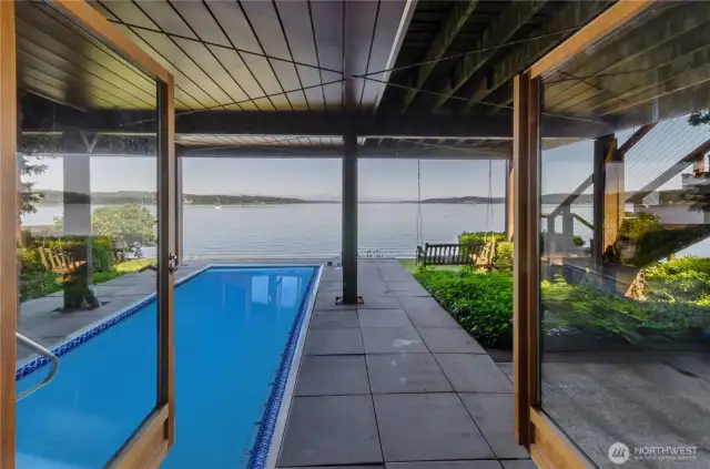 Swim spa is located under the main floor large deck and is easily accessed from the lower level wood French doors